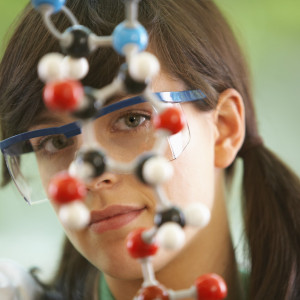 Clarissa hoped her employees would not be able to find her if she could blend into the cool DNA scuplture on her desk. 